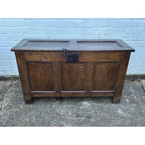 430 - An 18th Century oak coffer, with panelled top, front and sides -