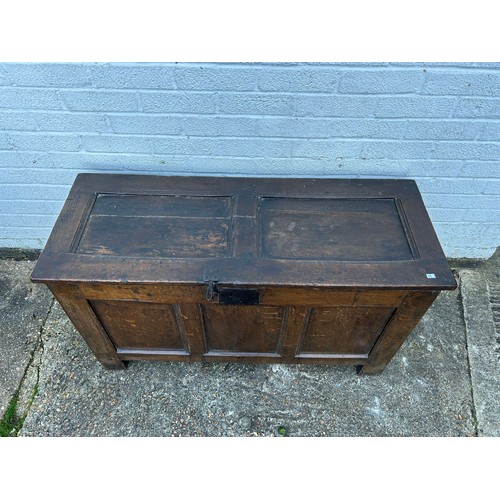 430 - An 18th Century oak coffer, with panelled top, front and sides -