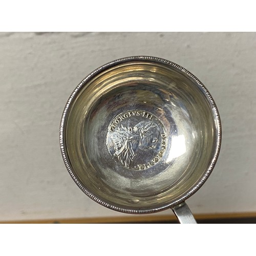 59 - A Georgian silver toddy ladle, inset with a George III coin together with a silver open spoon -