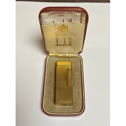 283 - A cased Dunhill gold plated lighter  -