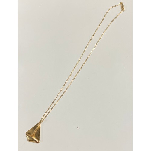 74 - A 14ct gold pendant on chain, in the form of a sailing yacht on fine link chain -