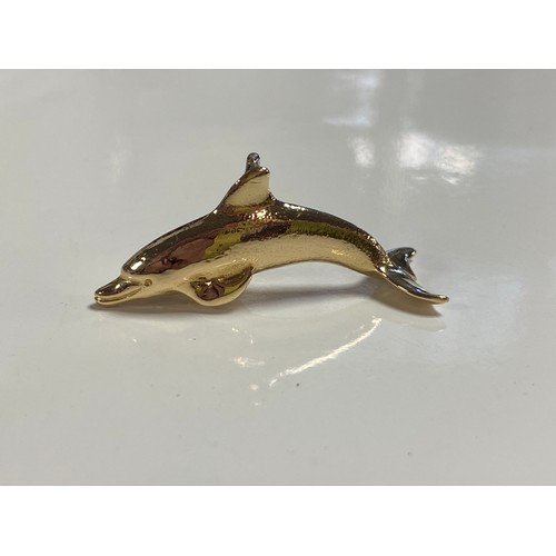 80 - A yellow metal pendant, in the form of a dolphin -