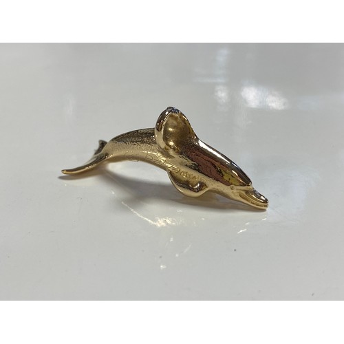 80 - A yellow metal pendant, in the form of a dolphin -