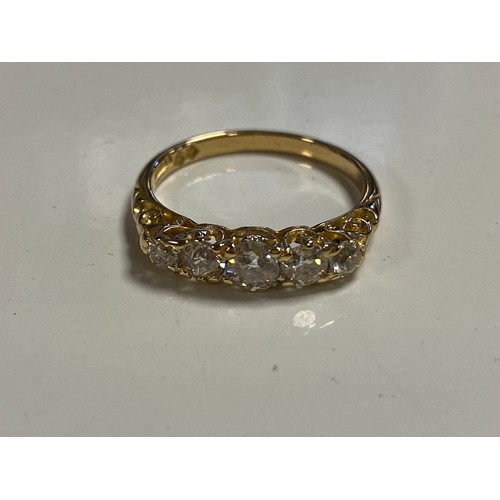 82 - A diamond five stone ring, set with a row of graduated diamonds, in 18ct gold mount -