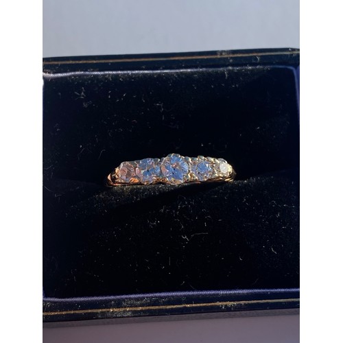 82 - A diamond five stone ring, set with a row of graduated diamonds, in 18ct gold mount -