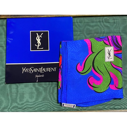 214 - An Yves St Laurent headscarf, in original folder -