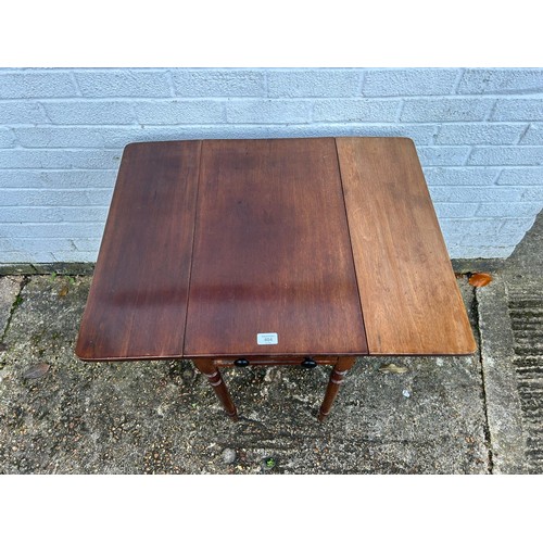 404 - A 19th Century mahogany Pembroke  table, with one real and one dummy drawer, on turned legs -