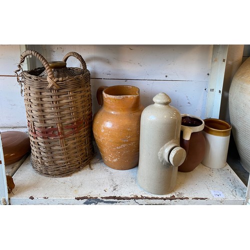 141 - A large stoneware two handled jar, a pottery jug, possibly Verwood, stoneware bed warmer, etc -