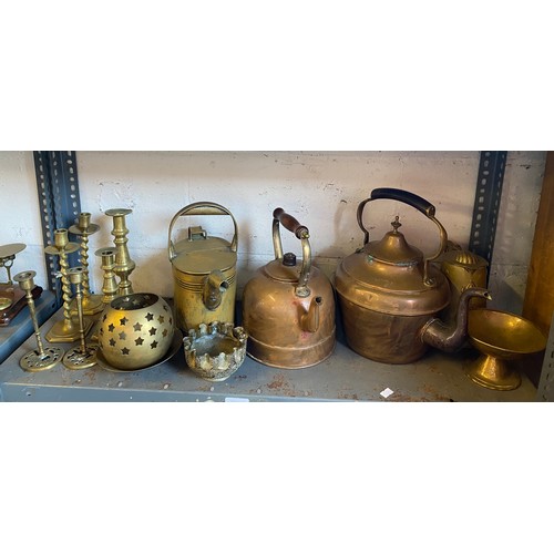 276 - A quantity of brassware, to include copper kettles, brass candlesticks etc -