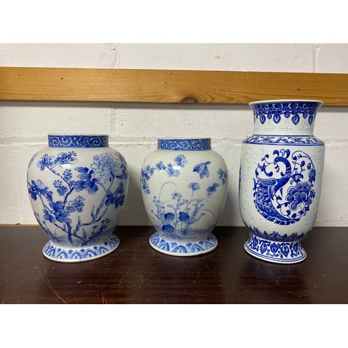 136A - A pair of Chinese blue and white vases, and another vase -