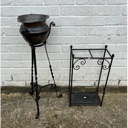 249 - A metal stick stand and a planter on stand -