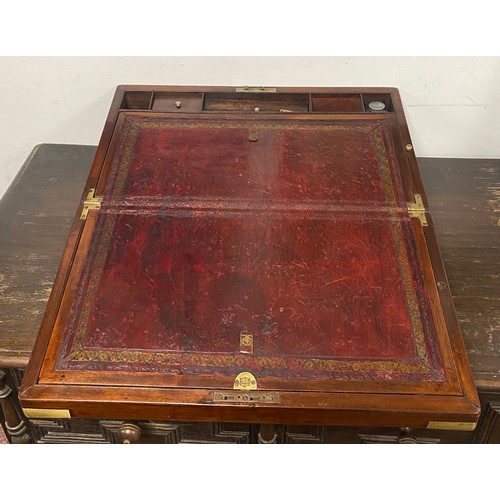 270 - A 19th Century brass mounted campaign style writing slope, with flush handles and side drawer -