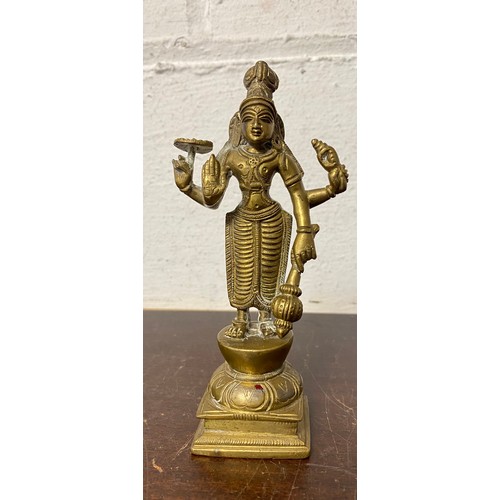 57 - A bronze of a standing deity -