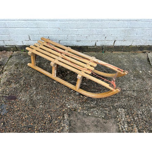 357 - A wooden framed toboggan -