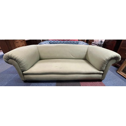 299 - A green upholstered Chesterfield style sofa -