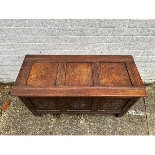 301 - An oak blanket box, with panelled sides -