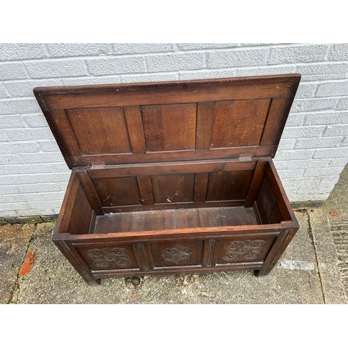 301 - An oak blanket box, with panelled sides -