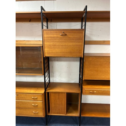 308 - A mid-century teak and metal framed modular Ladderax wall unit/room divider, with three bays, variou... 