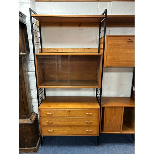 308 - A mid-century teak and metal framed modular Ladderax wall unit/room divider, with three bays, variou... 