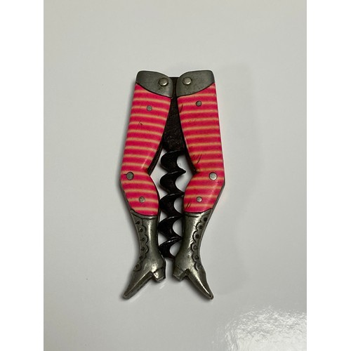 185 - An antique German 'Lady Legs' corkscrew, apparently un-named, with striped pink and white stockinged... 