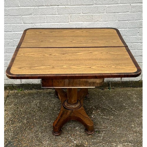 342 - A 19th Century rosewood foldover tea table, on central column and quatrefoil base -