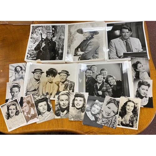 234 - A quantity of film stills and signed photo cards -