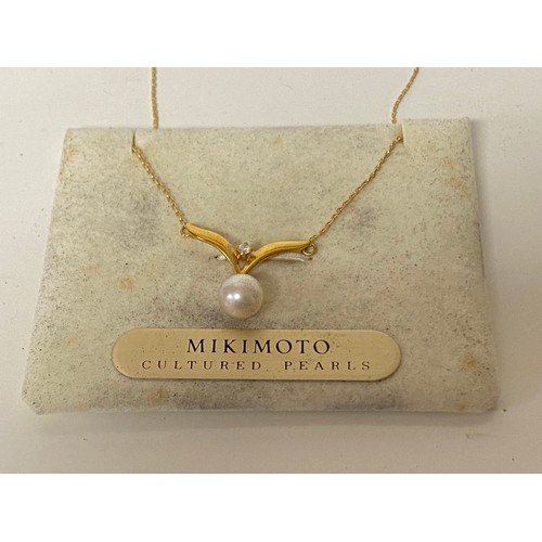 79 - A Mikimoto pearl and diamond set necklace, stamped 18k -