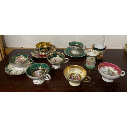 130 - A small group of continental cabinet cups, some with saucers -