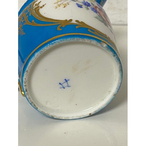 137 - A 19th Century Sevres jug, painted with a panel of flowers on a powder blue ground -