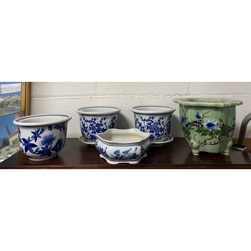 146 - A group of blue and white and other planters and saucers -