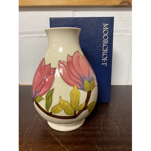 149 - A modern Moorcroft vase in the 'Magnolia' pattern -