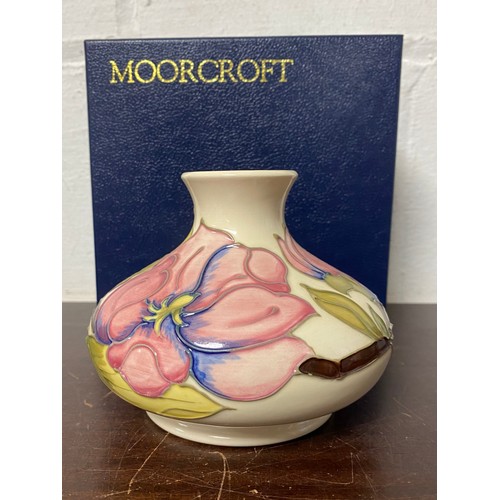 151 - A modern Moorcroft squat vase in the 'Magnolia' pattern -