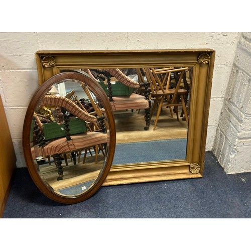 348 - A large rectangular wall mirror, with shell details to corners and an oval mirror (2) -