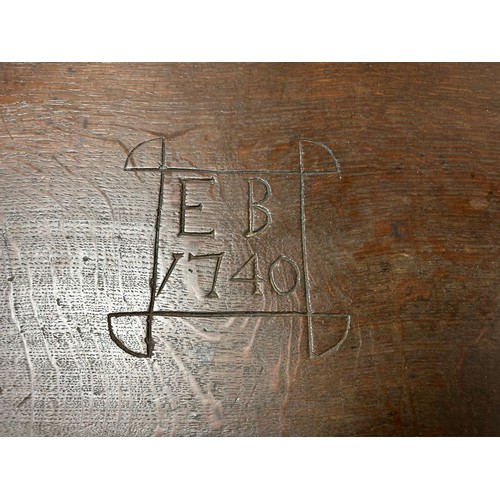 350 - An oak Bible box, with sloping front, carved with EB 1740, enclosing drawers over a carved fruiting ... 