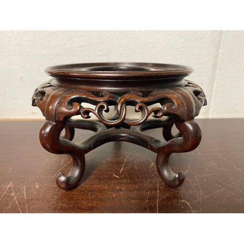 52 - A Chinese carved hardwood stand -