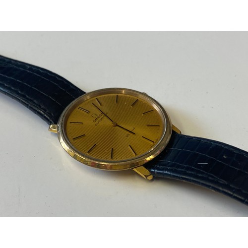 19 - A vintage Omega De Ville automatic wristwatch, model 1110107. in gold plated case, to leather strap ... 