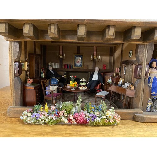 248 - A Robert Stubbs 'Radnor Hall' dolls house, designed as a three storey Tudor building, with eight lif... 