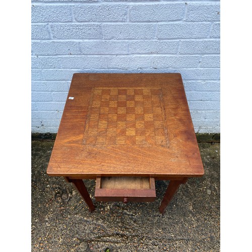 354 - An early 20th Century games table, the inset top over single drawer -