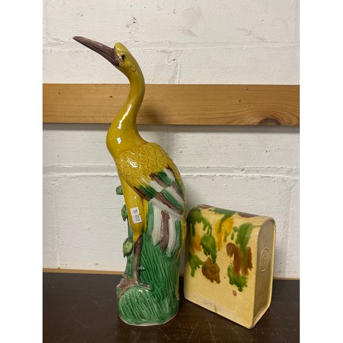 A Chinese Sancai glazed crane, impressed mark, with a similarly glazed opium pillow (2) -