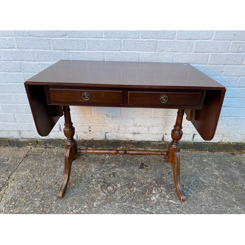A reproduction sofa table, with two frieze drawers on turned supports -