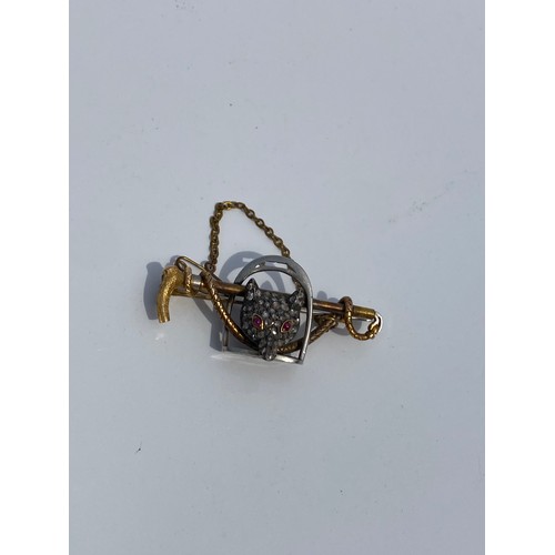 9 - A late Victorian/Edwardian diamond and ruby set foxhead brooch, the diamond set fox with ruby eyes m... 