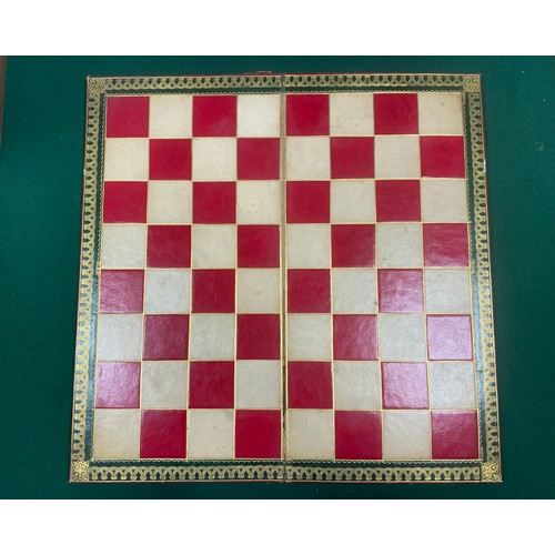 A folding leather chess board the exterior applied with raised decoration -