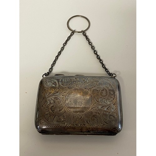 A George V silver purse, Birmingham 1921, with lined interior and finger suspension loop -
