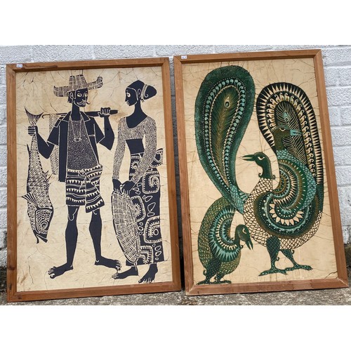 A pair of Batik panels, the first with peacock decoration, the second with figural decoration -