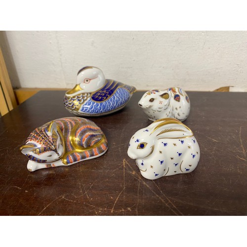 A group of four Royal Crown Derby paperweights, comprising of a bank vole, a rabbit, a cat and a duck (4) -