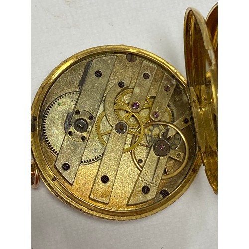 7 - An 18ct gold cased open face pocket watch, with roman markers and chased detail to dial, and an asso... 