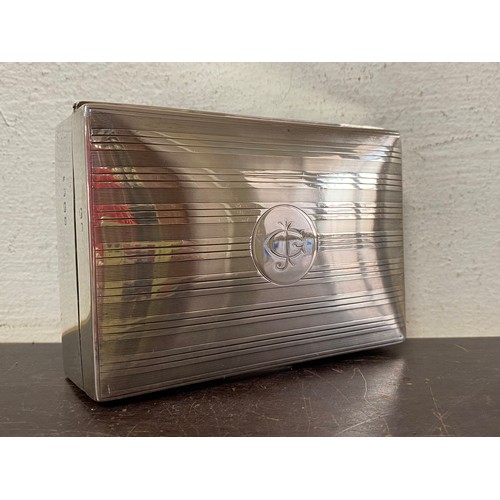 8 - A George VI silver cigarette box, Birmingham 1945, with initials to cover -
