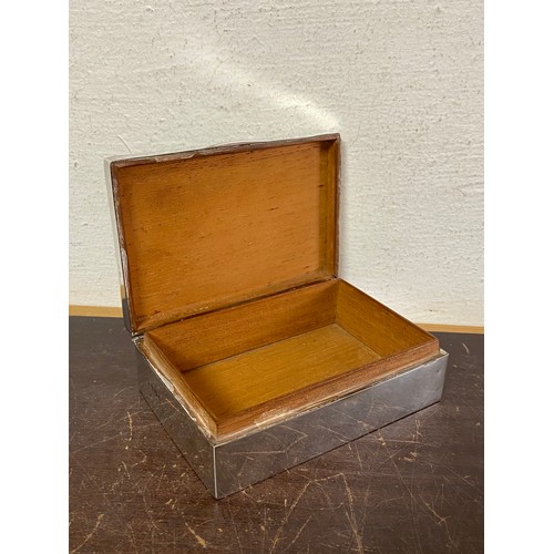 8 - A George VI silver cigarette box, Birmingham 1945, with initials to cover -