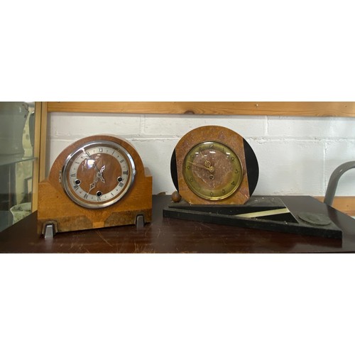 A group of four mantel clocks, including a Soviet example -
