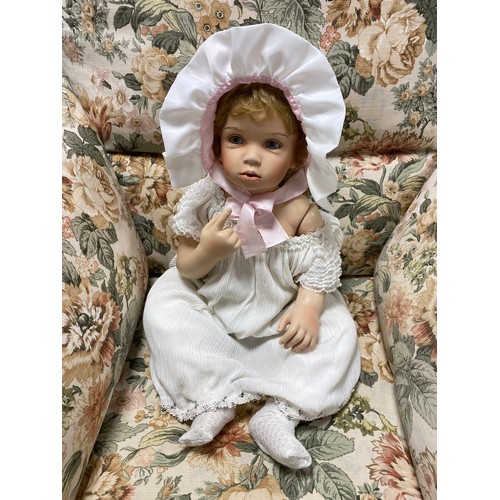 A large porcelain Gloria Vanderbilt doll -